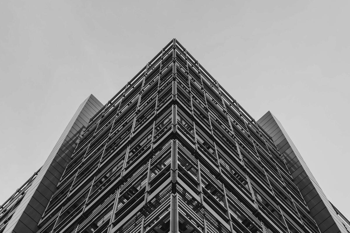 Looking up the corner of a glass office tower